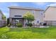 Landscaped backyard with patio, gazebo, fire pit, and well-manicured lawn at 15332 Atkinson Dr, Noblesville, IN 46060