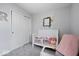 Light and airy Bedroom with a white crib, soft toys, and charming wall decorations at 15332 Atkinson Dr, Noblesville, IN 46060