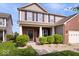 Beautiful two-story home with a brick and siding exterior, a well-maintained lawn, and a welcoming front porch at 15332 Atkinson Dr, Noblesville, IN 46060