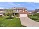 Inviting two-story home with a manicured lawn, brick and siding facade, and an attached two-car garage, perfect for suburban living at 15332 Atkinson Dr, Noblesville, IN 46060