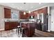 Modern kitchen boasts stainless steel appliances, granite countertops, and a functional island with bar stool seating at 15332 Atkinson Dr, Noblesville, IN 46060