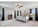 Spacious main bedroom with ample natural light, ceiling fan, and stylish decor for a relaxing retreat at 15332 Atkinson Dr, Noblesville, IN 46060