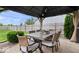 Covered patio dining area with seating for six and a fenced yard at 15332 Atkinson Dr, Noblesville, IN 46060