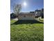 View of side of garage on a sunny day with grass and houses nearby at 1641 English Ave, Indianapolis, IN 46201