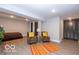 Finished basement featuring laminate flooring, neutral paint, and ample closet space at 1641 Iowa St, Indianapolis, IN 46203