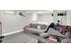 Finished basement featuring resilient flooring, a comfortable seating area and bed for relaxation or additional living space at 1641 Iowa St, Indianapolis, IN 46203