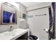 Stylish bathroom boasts a modern vanity, nautical decor, and a shower/tub combination with a decorative curtain at 1641 Iowa St, Indianapolis, IN 46203