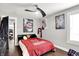 Bedroom featuring paintings on the wall, a ceiling fan and hardwood floors at 1641 Iowa St, Indianapolis, IN 46203