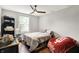 Cozy bedroom with ceiling fan, wood floors, closet space, and natural light at 1641 Iowa St, Indianapolis, IN 46203