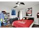 Bedroom featuring paintings on the wall, a ceiling fan and hardwood floors at 1641 Iowa St, Indianapolis, IN 46203