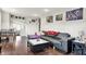 Spacious living room with modern furniture, including a large leather couch and stylish coffee table at 1641 Iowa St, Indianapolis, IN 46203