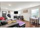 Bright and airy living room featuring a modern interior design, television, and wood flooring at 1641 Iowa St, Indianapolis, IN 46203