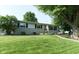 Charming home with well-manicured lawn, stone accents, and a welcoming front yard at 1855 Cruft St, Indianapolis, IN 46203
