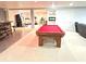 Basement game room area featuring a pool table, bar, treadmill, and workout machine at 18680 Long Walk Ln, Noblesville, IN 46060