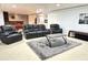 Finished basement with cozy seating area featuring a plush rug and a sleek coffee table at 18680 Long Walk Ln, Noblesville, IN 46060