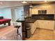 The basement bar features white cabinets, dark countertops, and a bar area with stools near the billiard table at 18680 Long Walk Ln, Noblesville, IN 46060