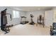 Basement gym with various exercise machines and natural light, creating an ideal space for fitness at 18680 Long Walk Ln, Noblesville, IN 46060