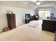 A spacious room with a high ceiling, featuring a ceiling fan and window at 18680 Long Walk Ln, Noblesville, IN 46060