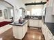 Open-concept kitchen featuring a center island, white cabinets, and views into the living area at 18680 Long Walk Ln, Noblesville, IN 46060
