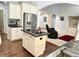 Kitchen with stainless steel appliances, an island cooktop, and an open view to the living room at 18680 Long Walk Ln, Noblesville, IN 46060