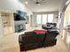 Spacious living room featuring built-in bookshelves, a fireplace, and a large seating area at 18680 Long Walk Ln, Noblesville, IN 46060