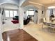 Open-concept living space with neutral tones, a fireplace, and seamless transition to the dining area at 18680 Long Walk Ln, Noblesville, IN 46060