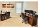 Functional home office featuring a wooden desk, comfortable chair, and ample storage space at 18680 Long Walk Ln, Noblesville, IN 46060