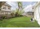 View of the backyard featuring a lush lawn and wood fence at 1906 N Park Ave, Indianapolis, IN 46202