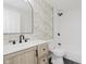 Stylish bathroom featuring patterned wallpaper and matte black fixtures at 1906 N Park Ave, Indianapolis, IN 46202