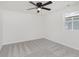 Neutral bedroom with carpet, ceiling fan, window overlooking the yard at 1906 N Park Ave, Indianapolis, IN 46202