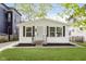 Charming renovated home boasts updated landscaping and a freshly painted exterior at 1906 N Park Ave, Indianapolis, IN 46202