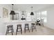 Stylish kitchen with modern appliances, breakfast bar, and dining area with natural light at 1906 N Park Ave, Indianapolis, IN 46202