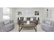Bright living room featuring neutral tones, modern furniture, and ample natural light at 1906 N Park Ave, Indianapolis, IN 46202