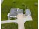 Aerial view of a home with a long driveway and detached garage at 1970 E 1100 N, Alexandria, IN 46001