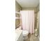 Full bathroom with toilet, and a bathtub with shower and curtain at 1970 E 1100 N, Alexandria, IN 46001