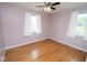 This bedroom has wood floors and two windows at 1970 E 1100 N, Alexandria, IN 46001