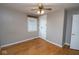 This bedroom features wood floors, a ceiling fan, and a closet at 1970 E 1100 N, Alexandria, IN 46001