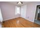 This bedroom has wood floors, a window, and a closet at 1970 E 1100 N, Alexandria, IN 46001