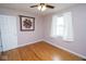 This bedroom has wood floors, a window, and a quilt at 1970 E 1100 N, Alexandria, IN 46001