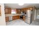 Well-lit kitchen featuring stainless steel appliances, ample cabinetry, and neutral countertops and backsplash at 1970 E 1100 N, Alexandria, IN 46001