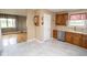 Open-concept kitchen with oak cabinets, stainless steel appliances, and easy access to the living room at 1970 E 1100 N, Alexandria, IN 46001