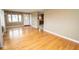 Spacious living room with gleaming hardwood floors, connecting to kitchen with an abundance of natural light at 1970 E 1100 N, Alexandria, IN 46001
