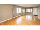 Cozy living room with hardwood floors, neutral walls, and large windows offering abundant natural light at 1970 E 1100 N, Alexandria, IN 46001