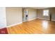 Open living room features hardwood floors, a laundry room, and neutral paint, creating a cozy atmosphere at 1970 E 1100 N, Alexandria, IN 46001