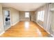 Bright living room featuring hardwood floors, neutral walls, and lots of natural light at 1970 E 1100 N, Alexandria, IN 46001