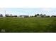 Spacious green lot surrounded by mature trees providing ample outdoor space at 1970 E 1100 N, Alexandria, IN 46001