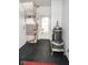 Mud room including an antique stove and modern furnace with herringbone pattern tile floors at 1970 E 1100 N, Alexandria, IN 46001