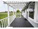Welcoming porch with white pergola, deck and railings offering a relaxing outdoor space at 1970 E 1100 N, Alexandria, IN 46001