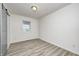 Bedroom featuring updated flooring, closet, and a window for natural light at 2021 Reformers Ave, Indianapolis, IN 46203