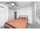 This bedroom features a ceiling fan, updated flooring, and a window for natural light at 2021 Reformers Ave, Indianapolis, IN 46203